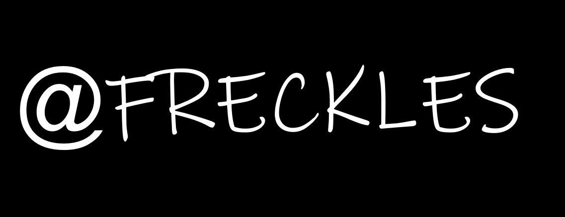 @FRECKLES hand-lettered in white on black